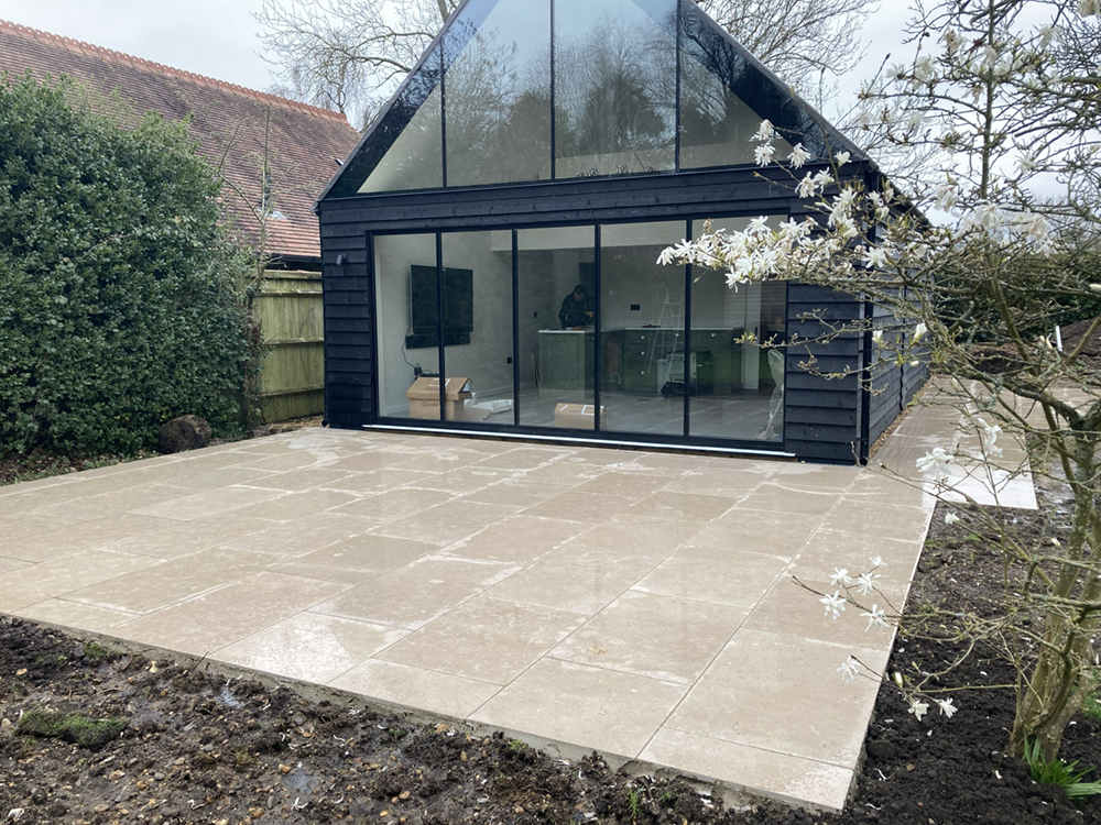 Finished Indian sandstone patio with warm natural paving tones in Wargrave