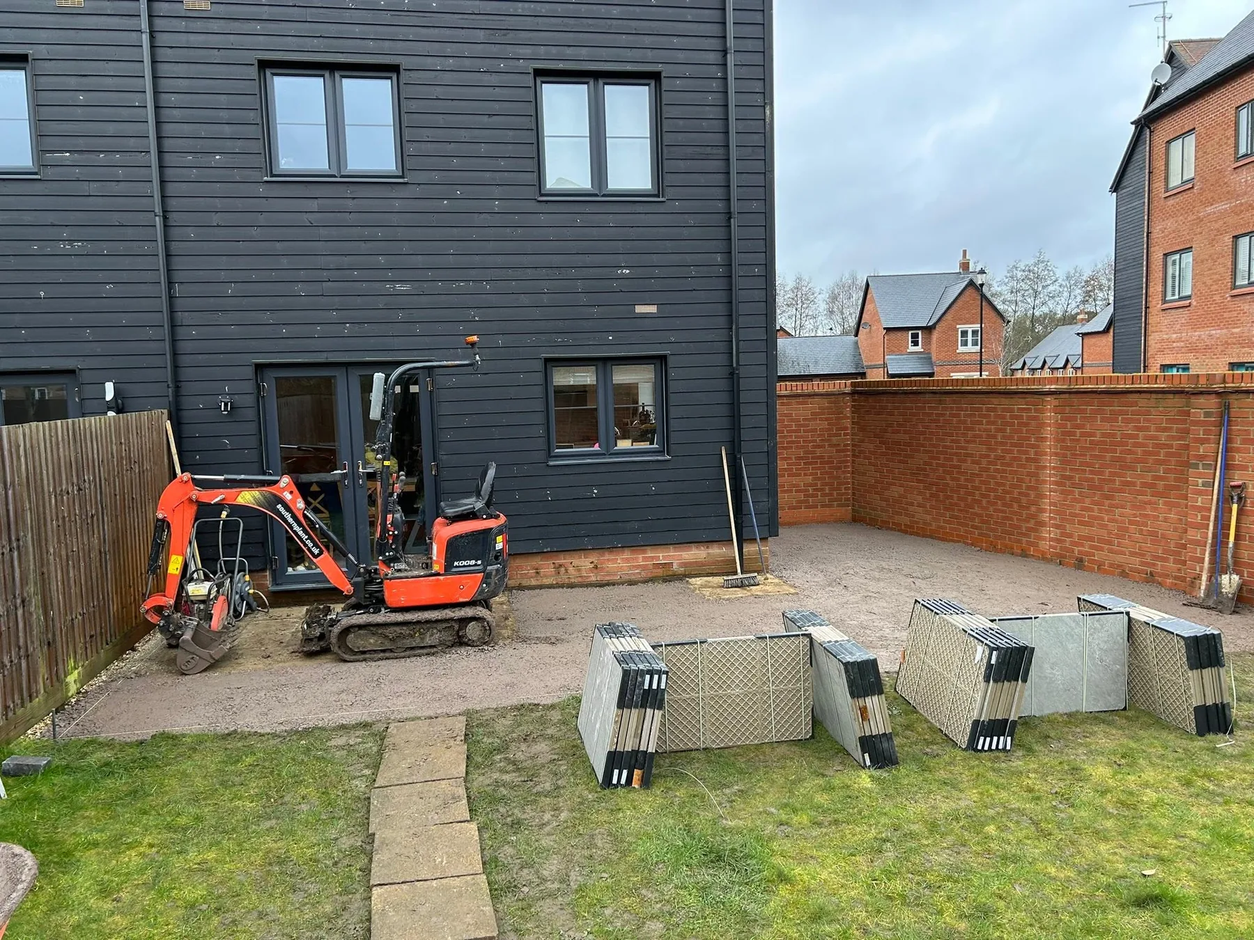porcelain patio groundworks in progress reading - Porcelain Patio with Granite Sett Edging in Reading